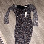 Long sleeve floral dress with sheer sleeves.   is being swapped online for free