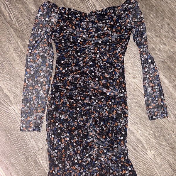 Long sleeve floral dress with sheer sleeves.   is being swapped online for free
