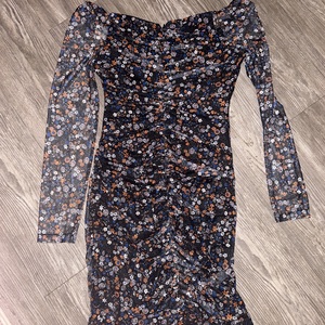 Long sleeve floral dress with sheer sleeves.   is being swapped online for free